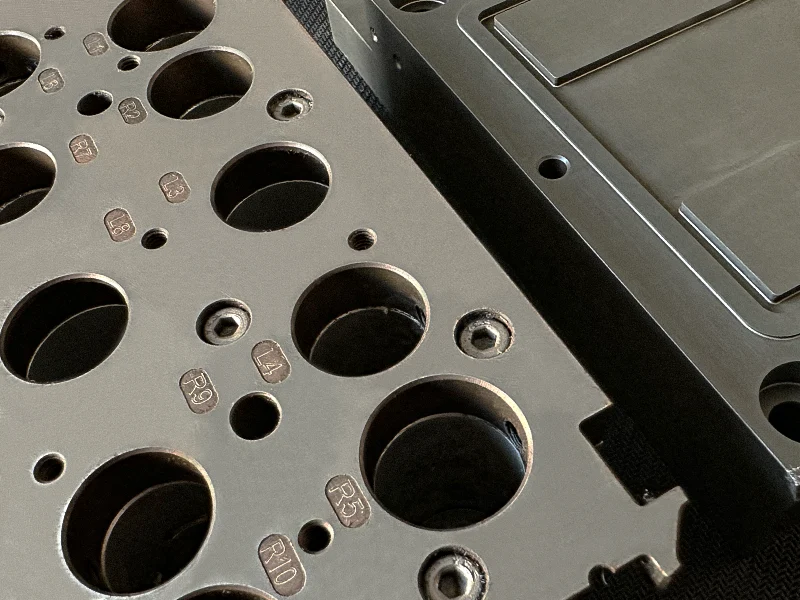 Hand holding a clear optical lens (optical flat)